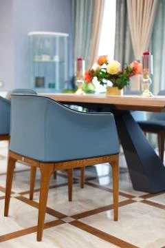 Large dining table with a tablecloth and two candles. Stock Photos