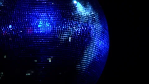 Large disco ball spinning and diffuses light blue 스톡 동영상 88433286