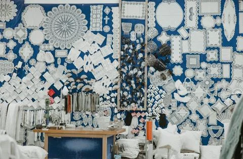 Large Display of Handmade Bobbin Lace Crafts in Traditional Artisan Shop Photos