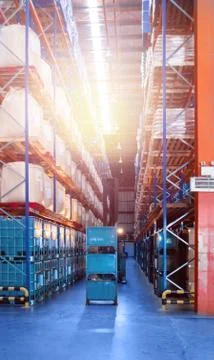 Large distribution warehouse interior, pallets and boxes of cargo. Stock Photos