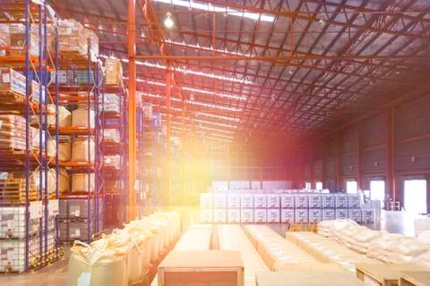 Large distribution warehouse interior, pallets and boxes of cargo. 写真素材