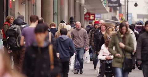 Large diverse crowd of people walking through British city shopping area Stock Footage 48116600