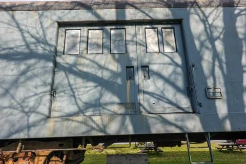 Large double door on the side of an old antique railroad train car Stock Photos