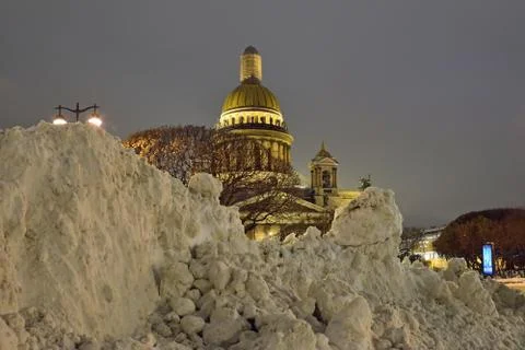 Large drifts of snow on the background of St. Isaac's Cathedral at night Stock Photos