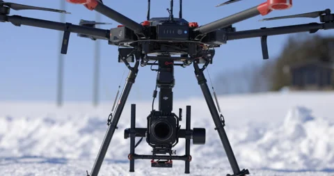 Large drone with cinematic camera prepares to take off in winter Stock Footage 148223273