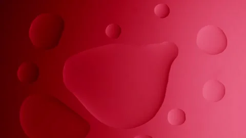 A large drop connects with a small one on a red gradient background 動画素材 303061011
