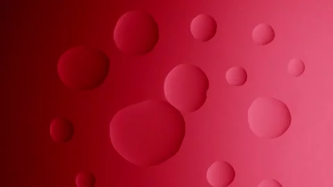 A large drop connects with a small one on a red gradient background Видео 303061021