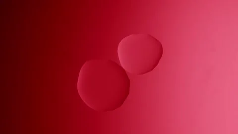 A large drop will connect with a smaller one on a red gradient background Видео 303060991
