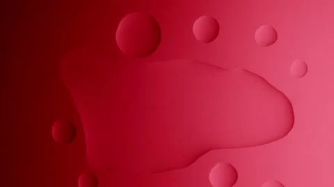 A large drop will connect with two smaller ones on a red gradient background Видео 303061028