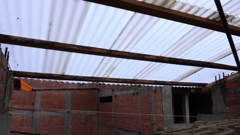 Large drops of intense rain falling from the calamine roof on the roof of a Stock Footage 164620700