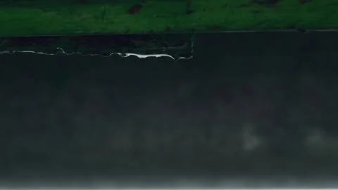 Large drops of rain fall down the pipes and roof Stock Footage 246959110
