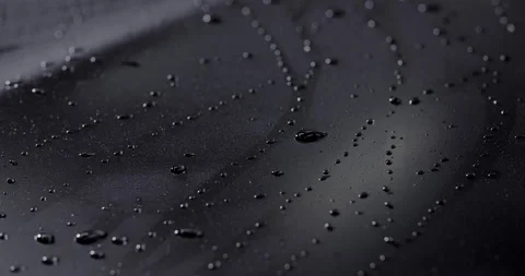 Large drops of water on the dark surface, water on the car after carwash in Stock Footage 188570981