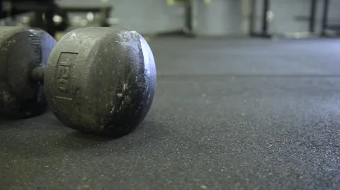 Large Dumbbell on Athletic Surface Stock Footage 54373031
