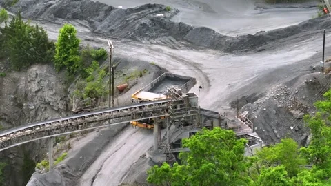 Large dump truck operating in an American gravel quarry. Industrial mining Stock Footage 313872687
