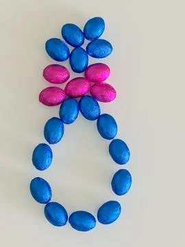 Large Easter Egg with Chocolate Eggs and Pink Bow Stock Photos