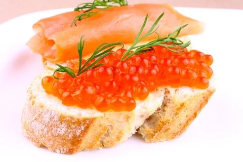 Large eggs red caviar on bread with dill Stock Photos