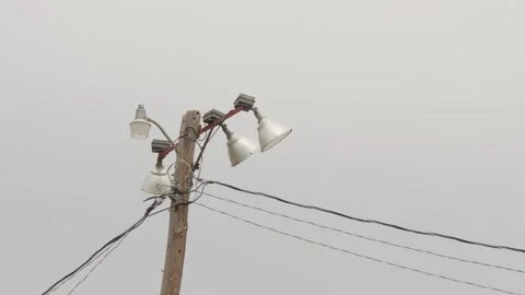 Large electrical floodlights used for lighting sports fields. Stock Footage 330431975