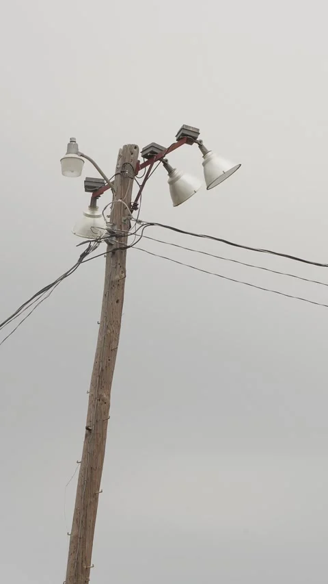 Large electrical floodlights used for lighting sports fields. Vertical Stock Footage 330488925