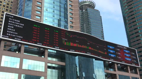 Large electronic ticker board, office building, stock exchange Shanghai China Stock Footage