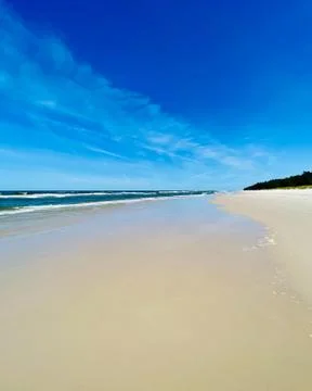 A large, empty beach on the sea. Stock Photos