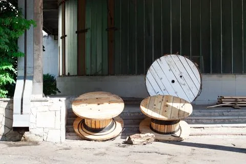 Large empty cable reels. nailed wood and plywood reels are used for a wide ra Stock Photos