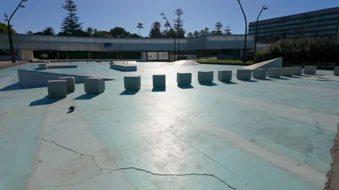 A large empty fountain or pool with an array of cube-like features in the Stock Footage 263792452