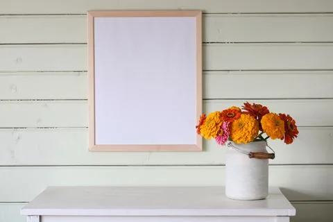 Large empty frame, a mockup, a stage creator. a white table in the cottage, a Stock-Fotos