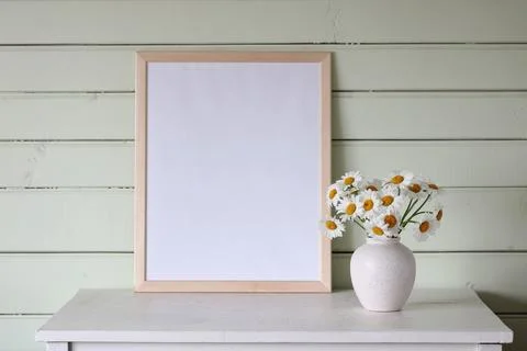 Large empty frame, a mockup, a stage creator. a white table in the cottage, a Stock-Fotos