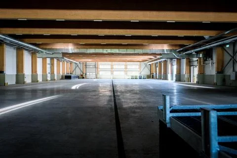 Large empty modern warehouse. Industrial storage facilities. Stock Photos