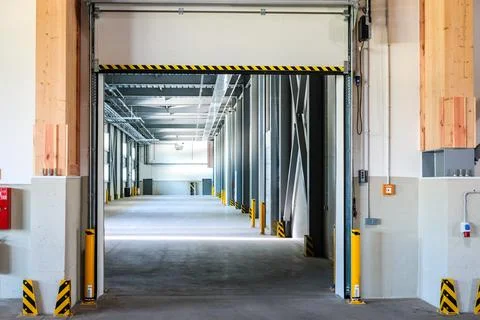 Large empty modern warehouse. Industrial storage facilities. Stock Photos