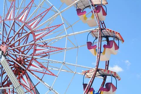Large empty observation wheel against blue sky Stock Photos