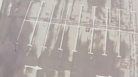 Large empty parking lot after rain. wet asphalt. white line markings Stock Footage 153715425