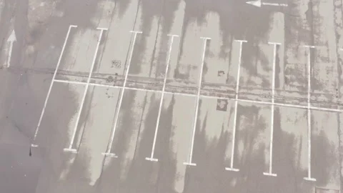 Large empty parking lot after rain. wet asphalt. white line markings Stock Footage 153716709