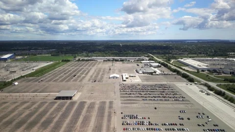 Large empty parking lot at automotive manufacturer plant inventory yard. Stock Footage 320843058