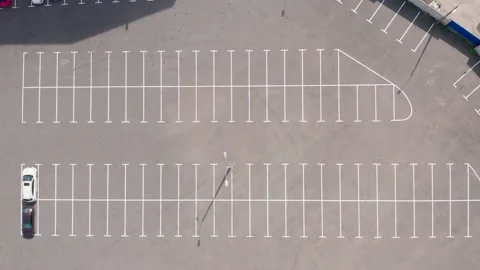 Large empty parking lot. few cars in the parking lot. white line markings Video stock 154873438