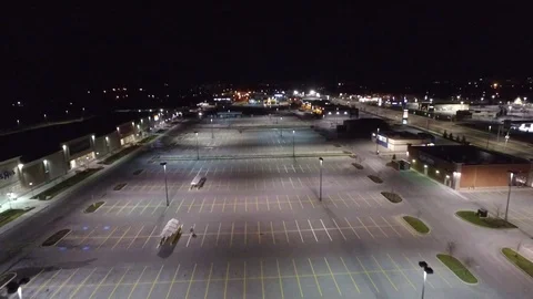 Large Empty Parking Lot At Night In Strip Mall Aerial Flyover 動画素材 88918940