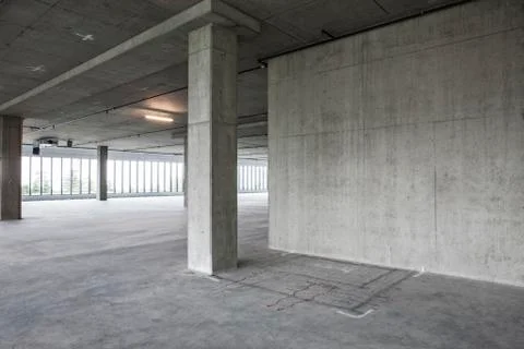 Large empty raw office space with plans sketched onto the floor in chalk. Stockfoto's