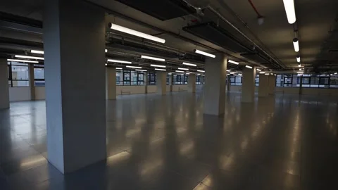 A large, empty room with a lot of light shining on the floor Stock Footage 297860480