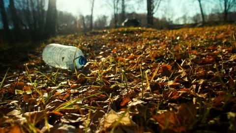 Large empty water bottle on ground Stockbeeldmateriaal 165089750