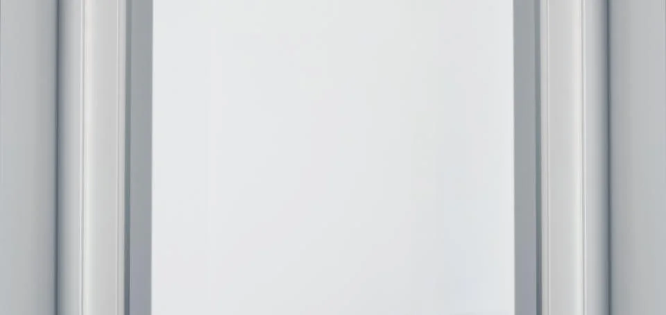 A large, empty whiteboard with a simple gray frame, set against a neutral bac Stock Photos