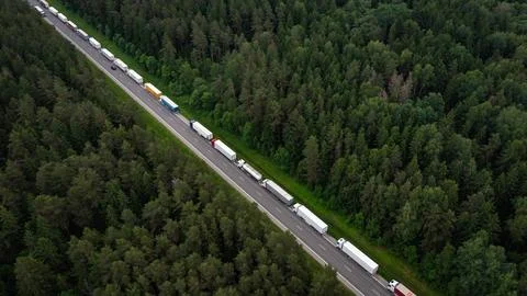 Large endless queue of trucks to from Lithuania to Belarus border Stock Photos