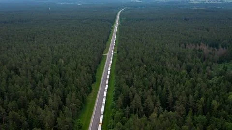 Large endless queue of trucks to from Lithuania to Belarus border Stock Photos