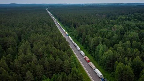 Large endless queue of trucks to from Lithuania to Belarus border Stock Photos
