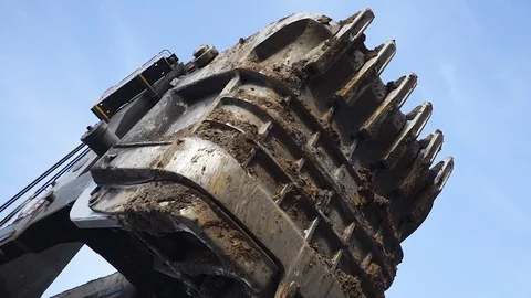 Large excavator bucket. covered in clay. coal mine Stock Footage 106914194