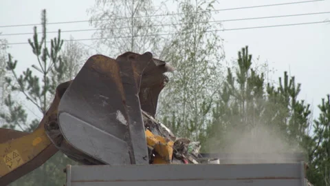 Large Excavator Bucket Garbage Loader Stock Footage 308593923