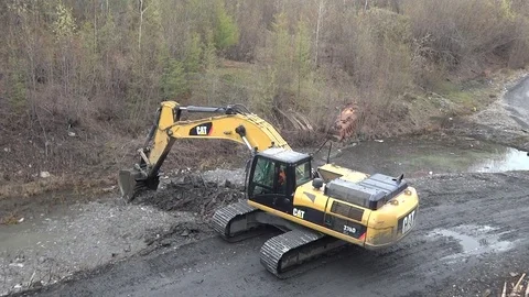 A large excavator cleans the ditch Stock Footage 121122925