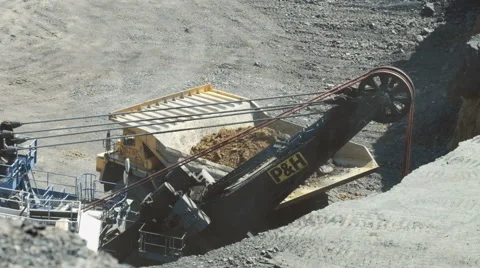 A large excavator loads Stock Footage 63359171