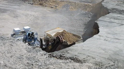 A large excavator loads Stock Footage 63359306