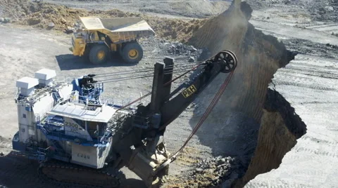 A large excavator loads Stock Footage 63360454