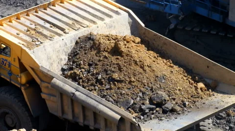 A large excavator loads Stock Footage 63360556